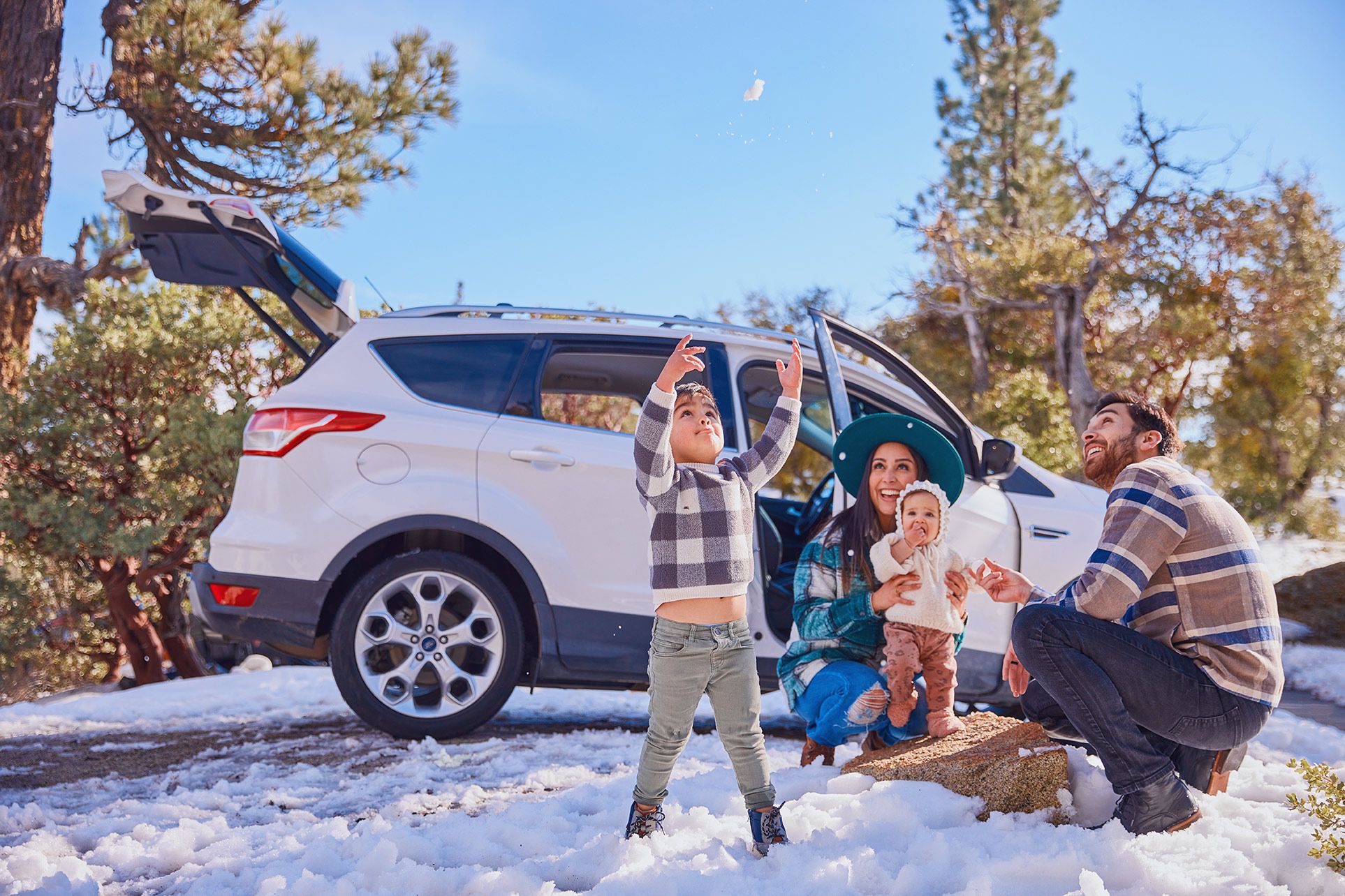 Family in the snow for alternative fuel advertising campaign 