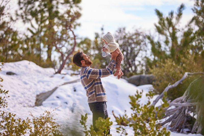 Father. playing with daughter in the snow of Idyllwild Mountain for  Nacero lifestyle campaign in