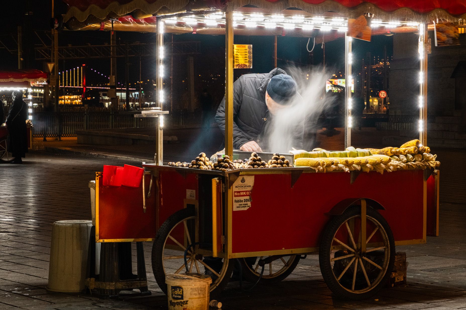 Night vendor in Istanbul with red cart 