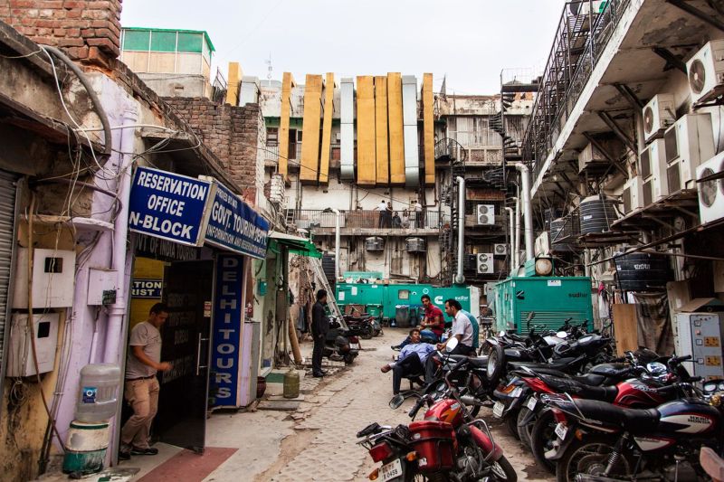 Air conditioning systems on the wall in a popular area of New Delhi, India
