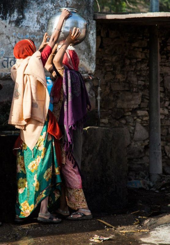 Women loading vases for  supply at a Rajasthan Village